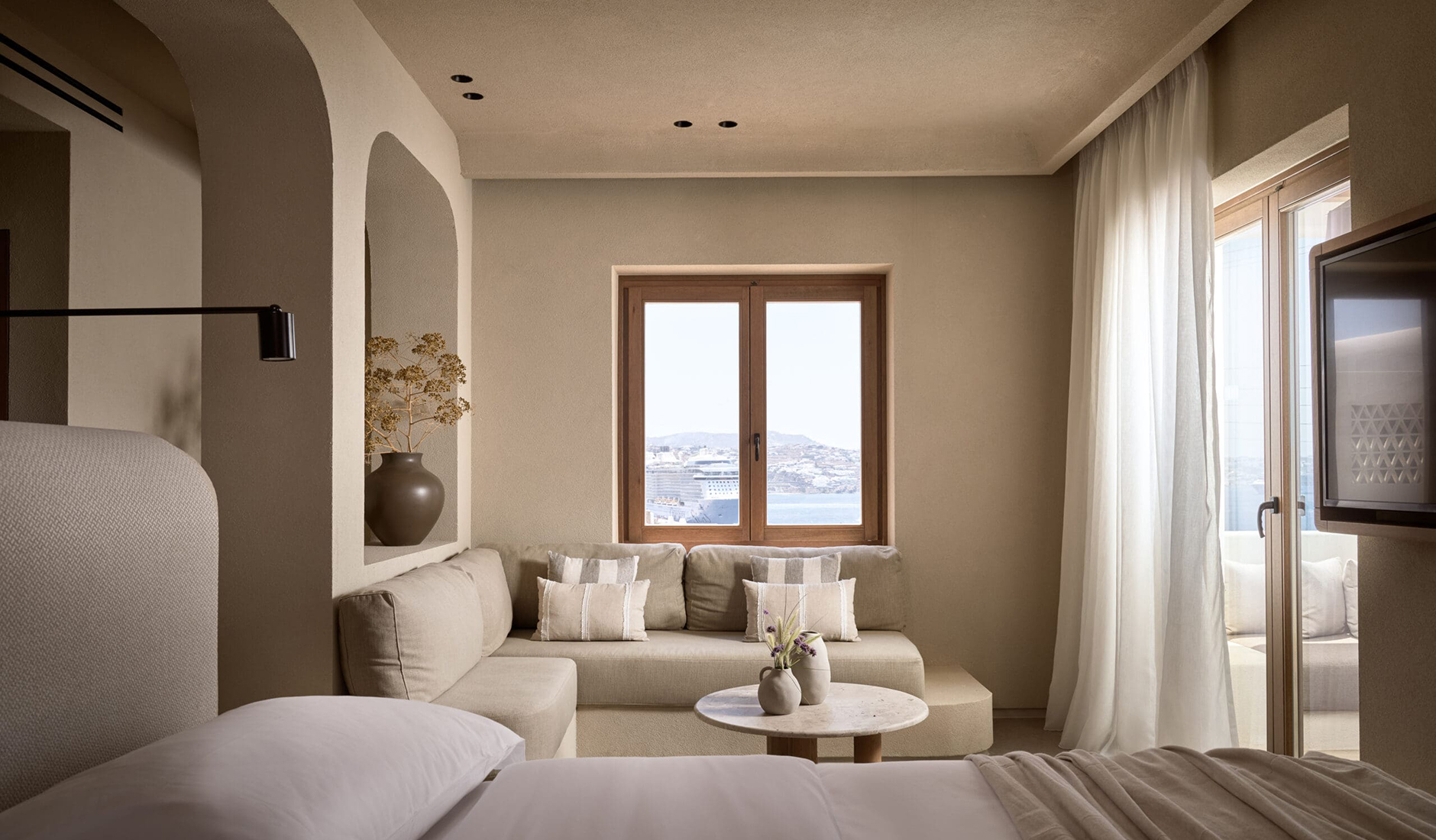 Premium suite with a private plunge pool at Omeon Mykonos, highlighted by Condé Nast Traveller as one of the best hotel accommodations on the island.