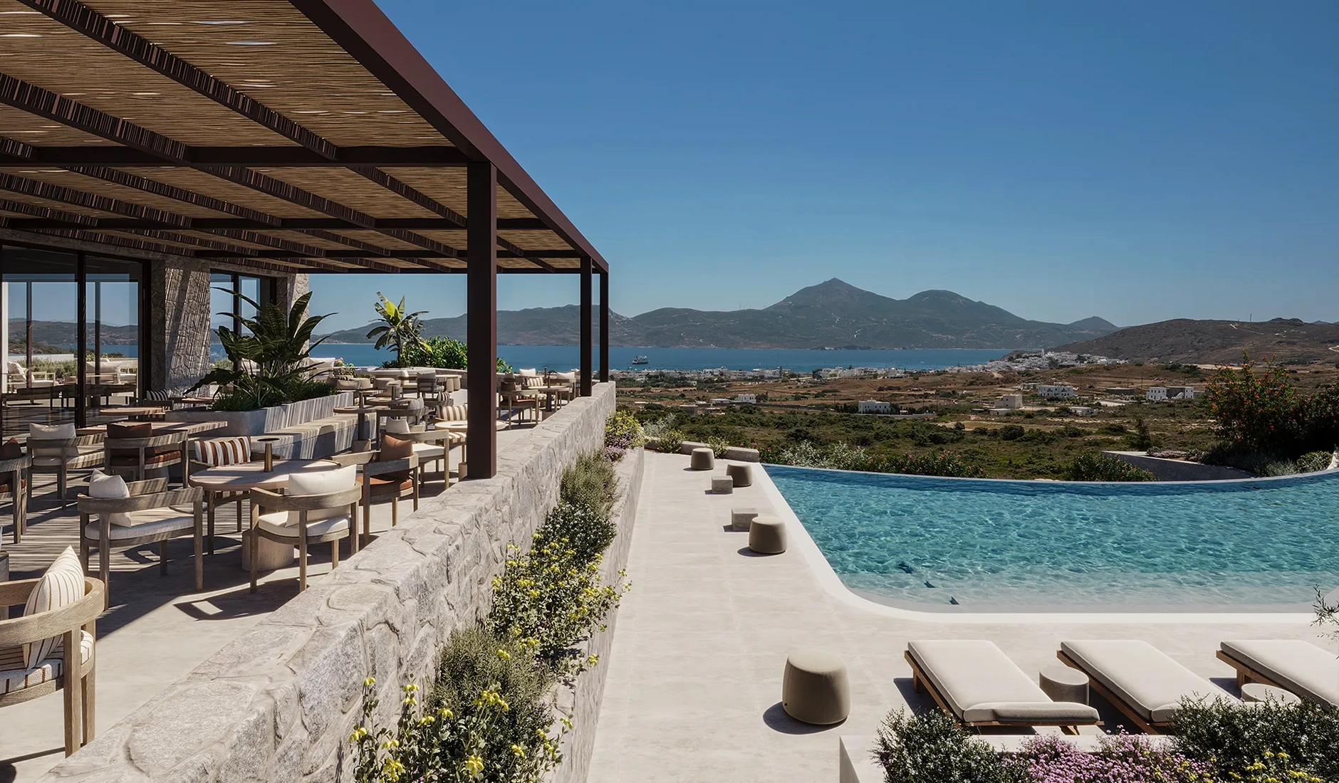 Outdoor dining at Spóros restaurant at Onero Milos with a sea view