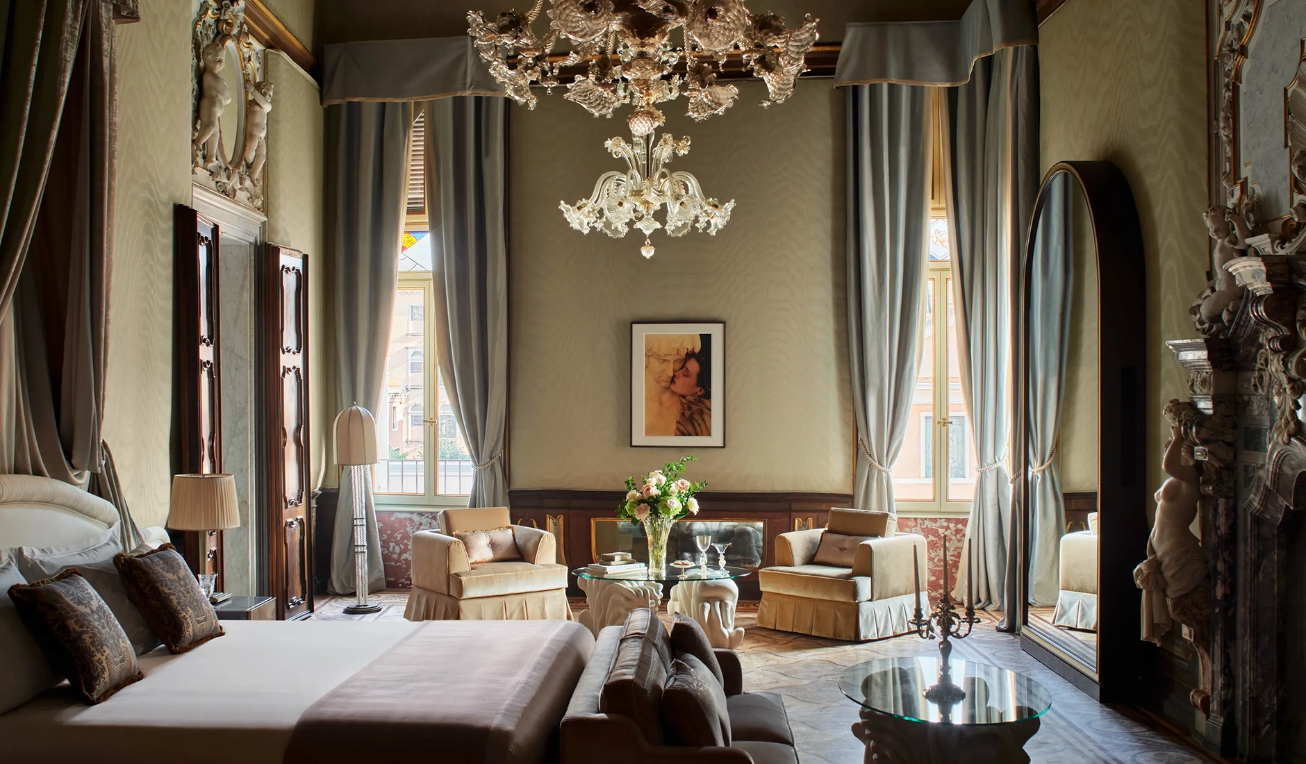 Opulent interior of a five-star suite at the Orient Express hotel in Venice, featuring heritage Italian design, plush furnishings, and high ceilings.