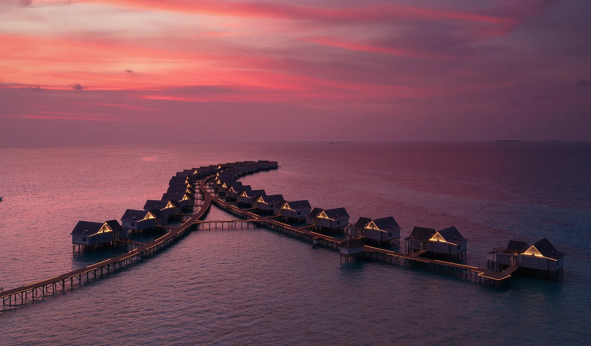 Aerial view of RAH GILI Maldives, a private island resort surrounded by the turquoise waters of South Malé Atoll