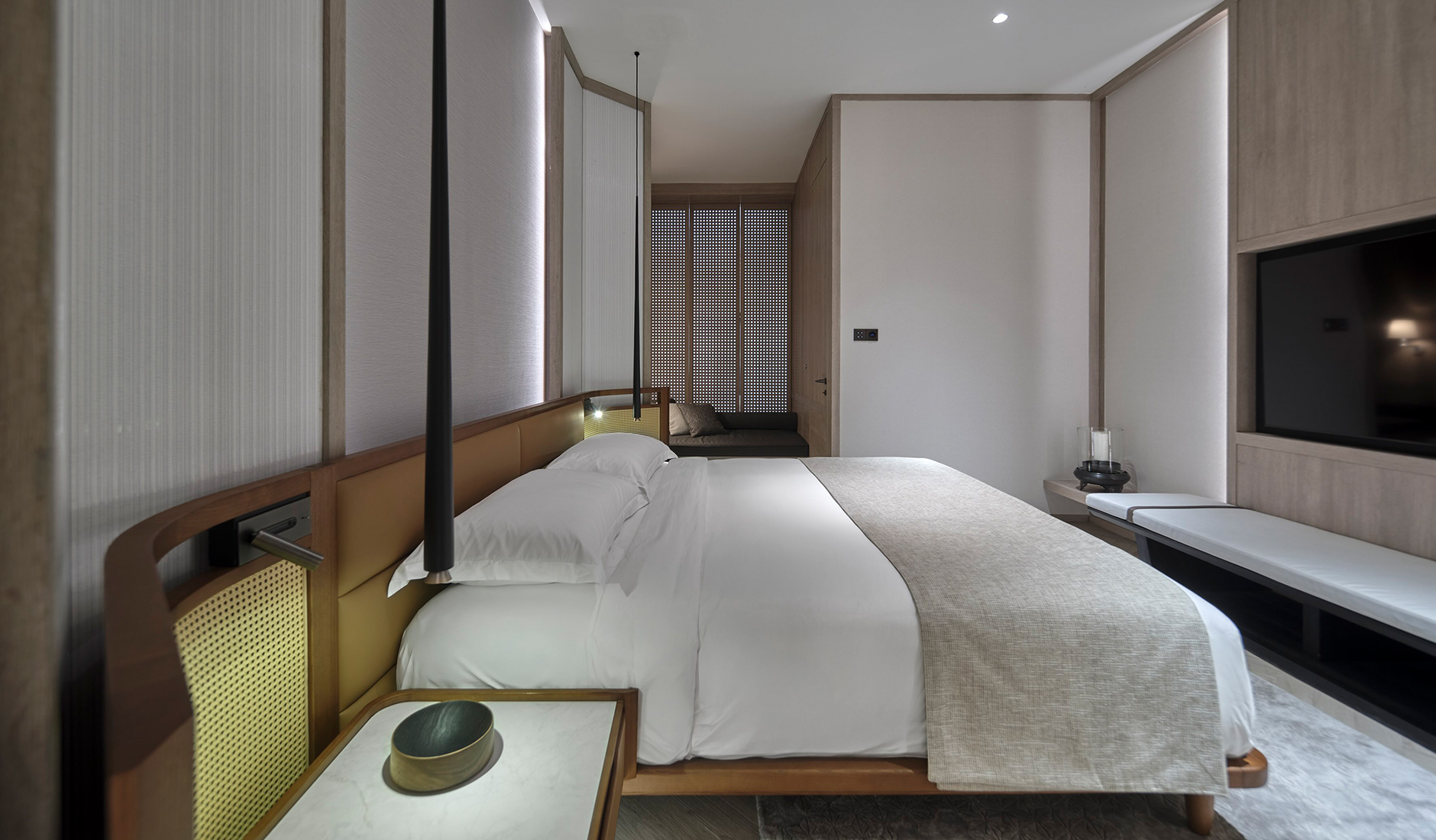 Spacious luxury bedroom at Soori Penang, combining restored shophouse architecture with contemporary furnishings