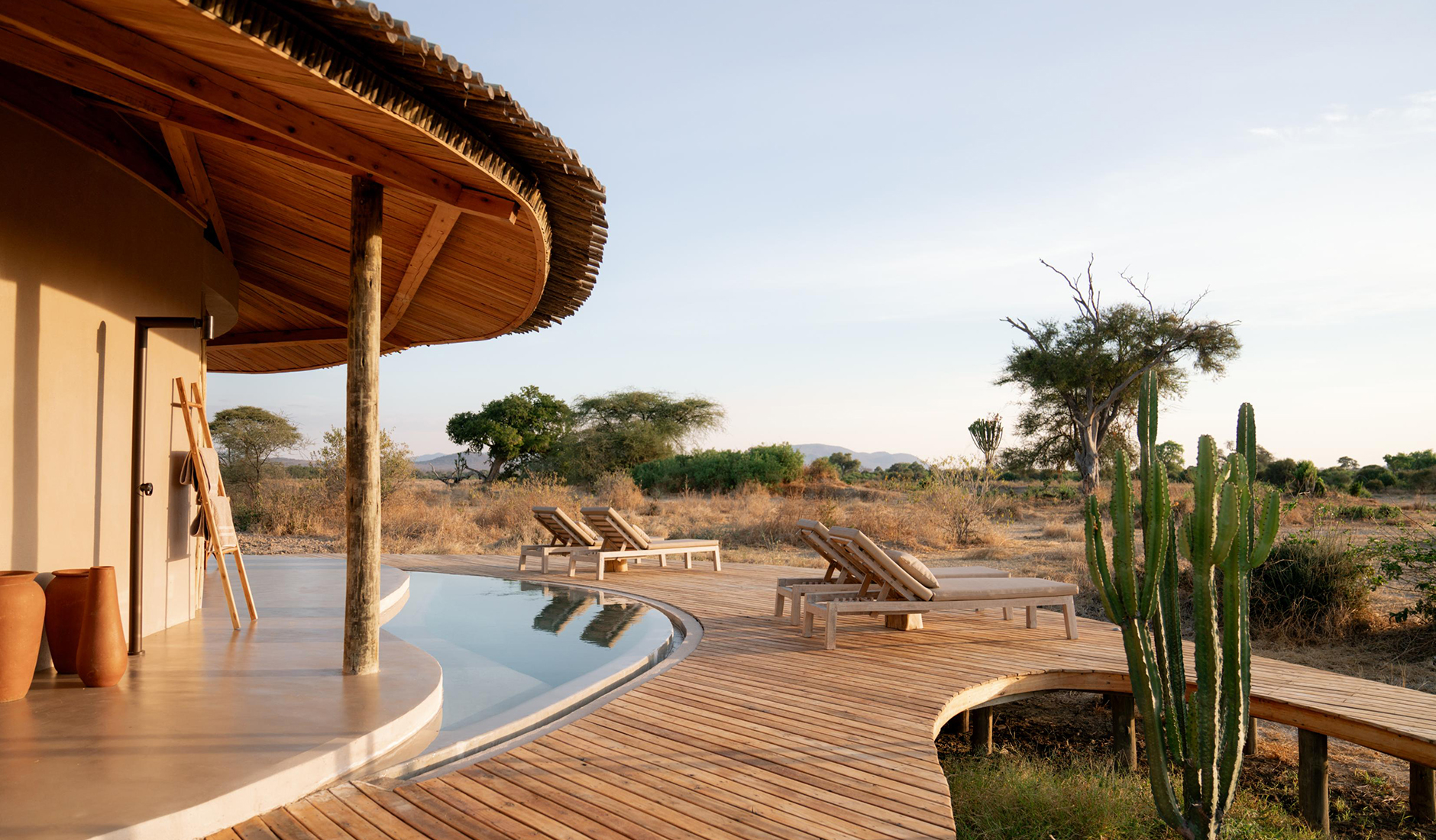 Private plunge pool deck of a luxury riverfront suite at Ubuyu, offering panoramic views of ancient baobab trees and wild African savannah.