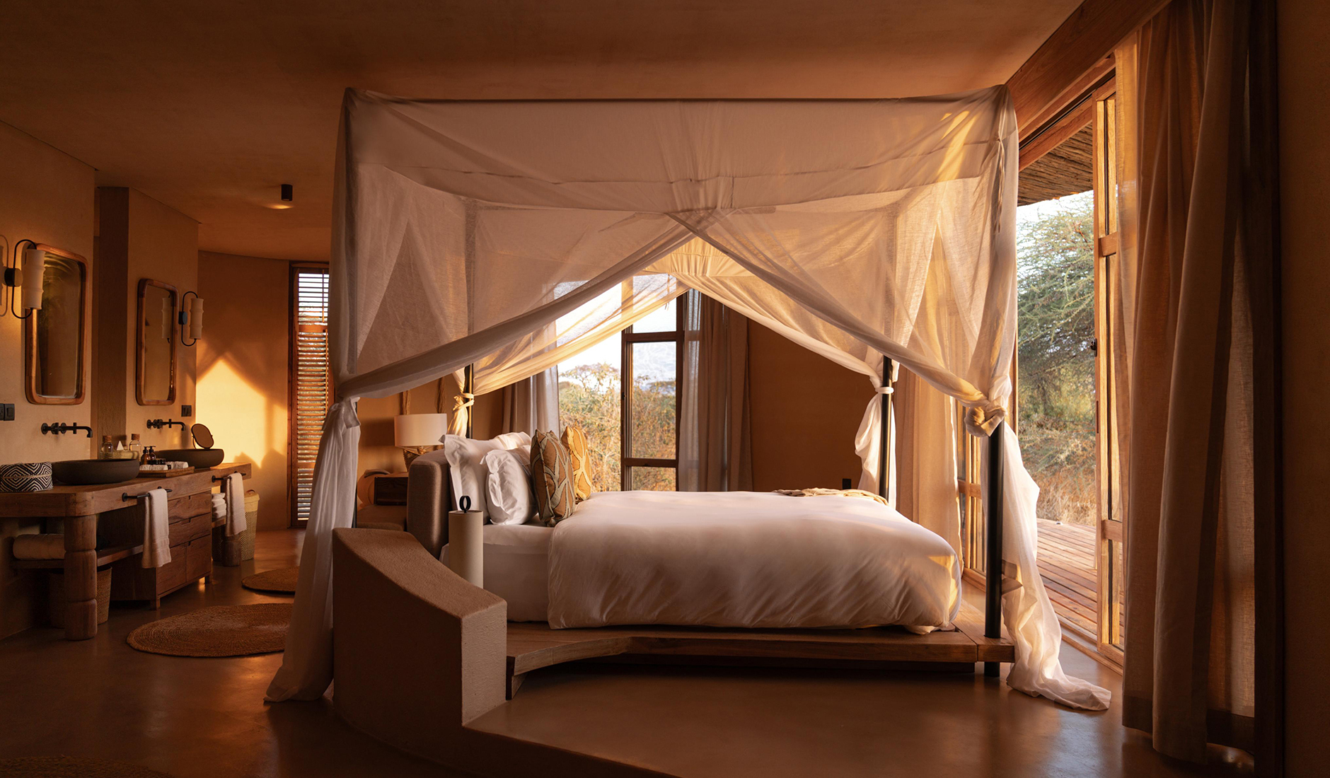Interior of a sculptural safari villa at Ubuyu Banyan Tree Escape, showcasing organic Maasai-inspired architecture, mninga wood furniture, and canvas-free design.